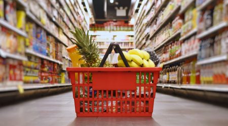 Basket with groceries in the supermarket